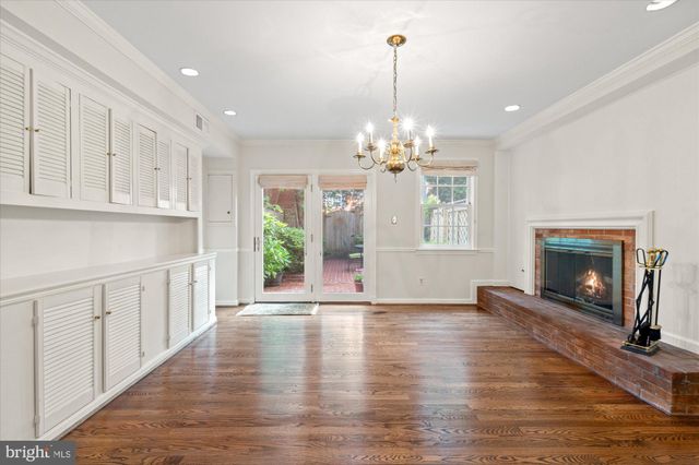 a view of livingroom with kitchen and hardwood