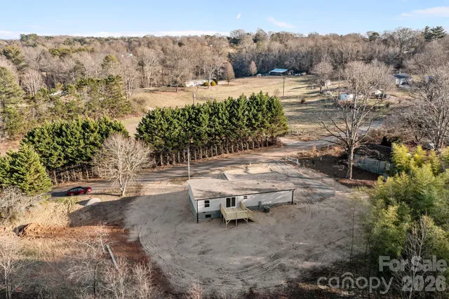 a view of green field with trees
