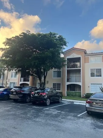 a view of a car park in front of house