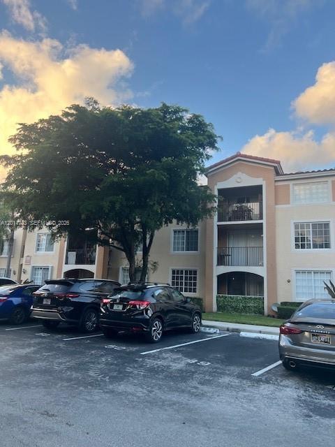 2103 Renaissance Boulevard, Unit 307 Miramar, FL 33025 - Photo 1 of 25 a view of a car park in front of house