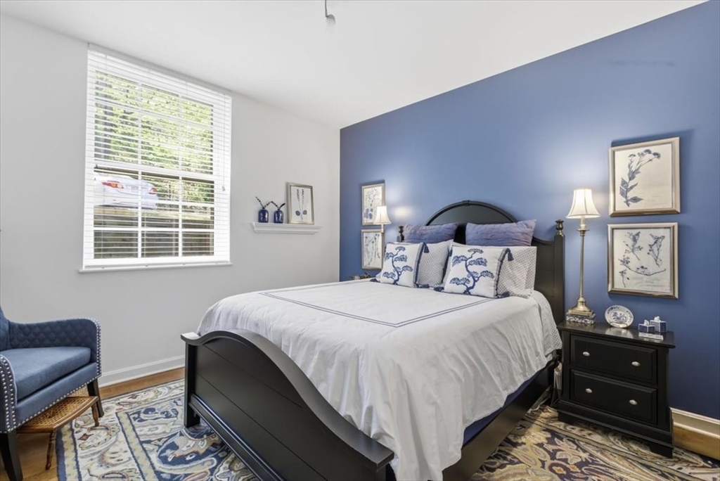 65 Glen Road, Unit H1 Brookline, MA 02445 - Photo 20 of 39 a bedroom with a bed and wooden floor