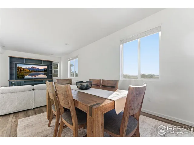 a view of a dining room with furniture and window