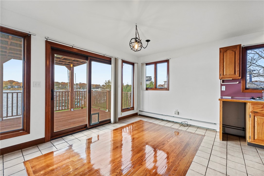 1 Rodeo Drive Barrington, RI 02806 - Photo 11 of 37 Waterfront deck off dining area