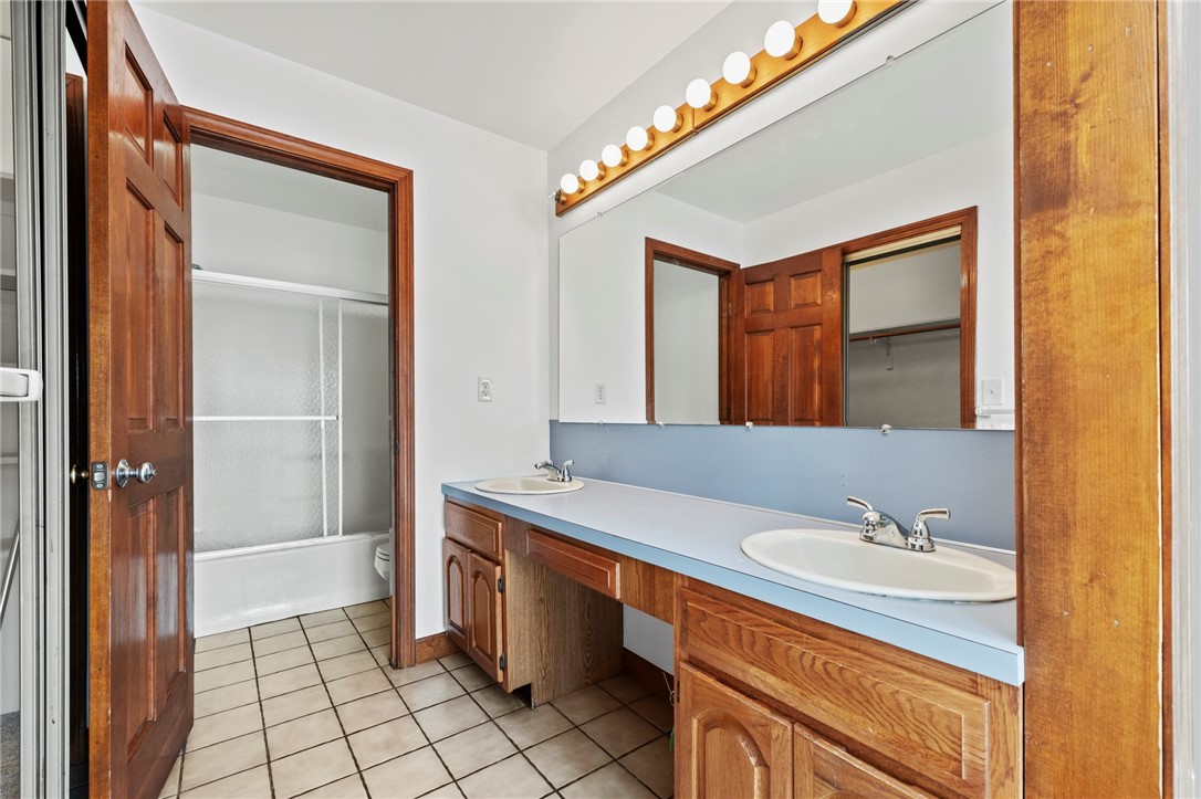 1 Rodeo Drive Barrington, RI 02806 - Photo 18 of 37 Primary bathroom with double sinks and separate shower area and separate walk-in closet