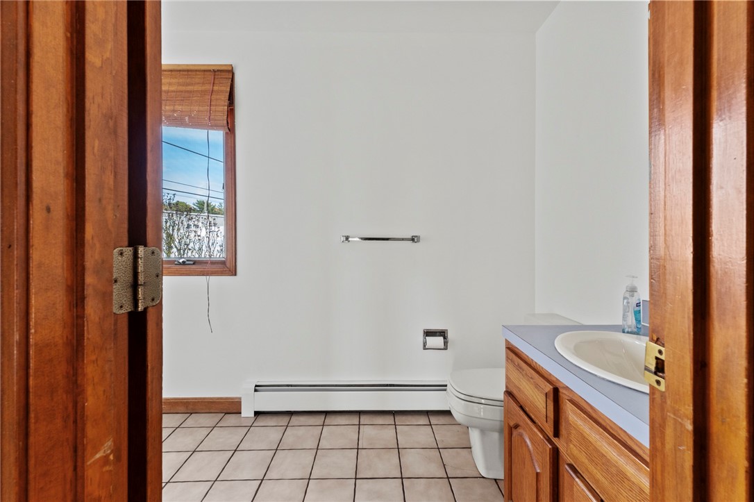 1 Rodeo Drive Barrington, RI 02806 - Photo 26 of 37 Half bath on main level with laundry area. Tenant to supply own washer