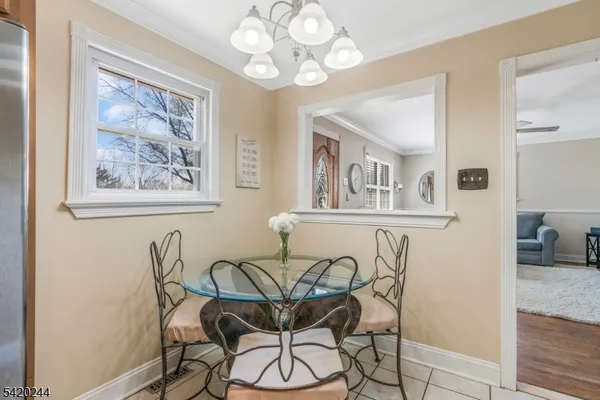 a aerial view of a house with a yard basket ball court and outdoor seating
