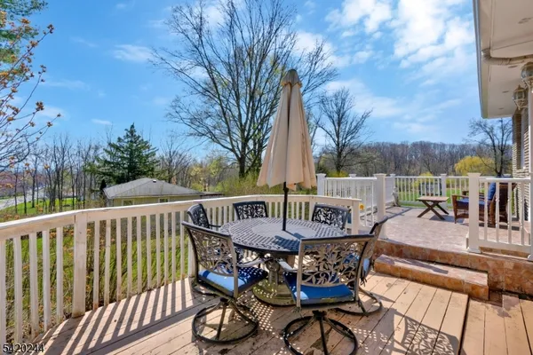 a view of a dining room with furniture and a chandelier