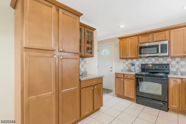 an aerial view of a residential houses with outdoor space