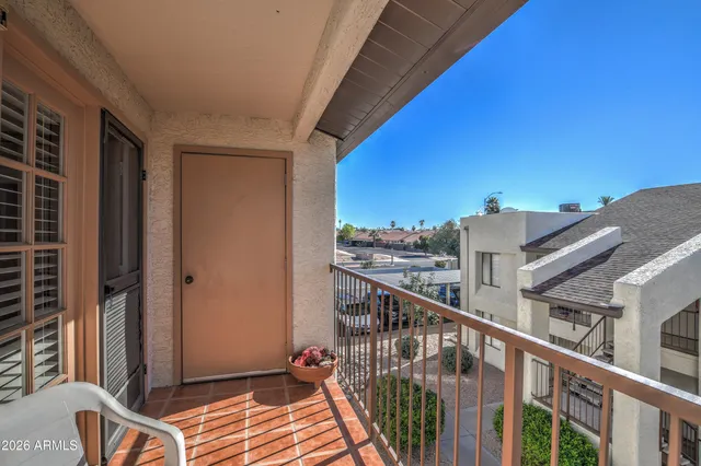 a balcony with view of city