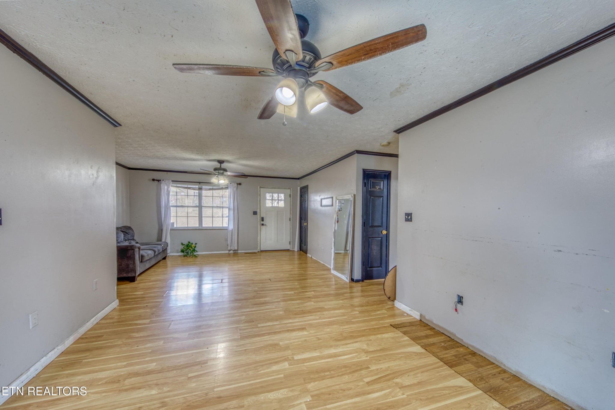 7700 McDaniel Road Knoxville, TN 37924 - Photo 11 of 18 a view of an empty room with window and wooden floor