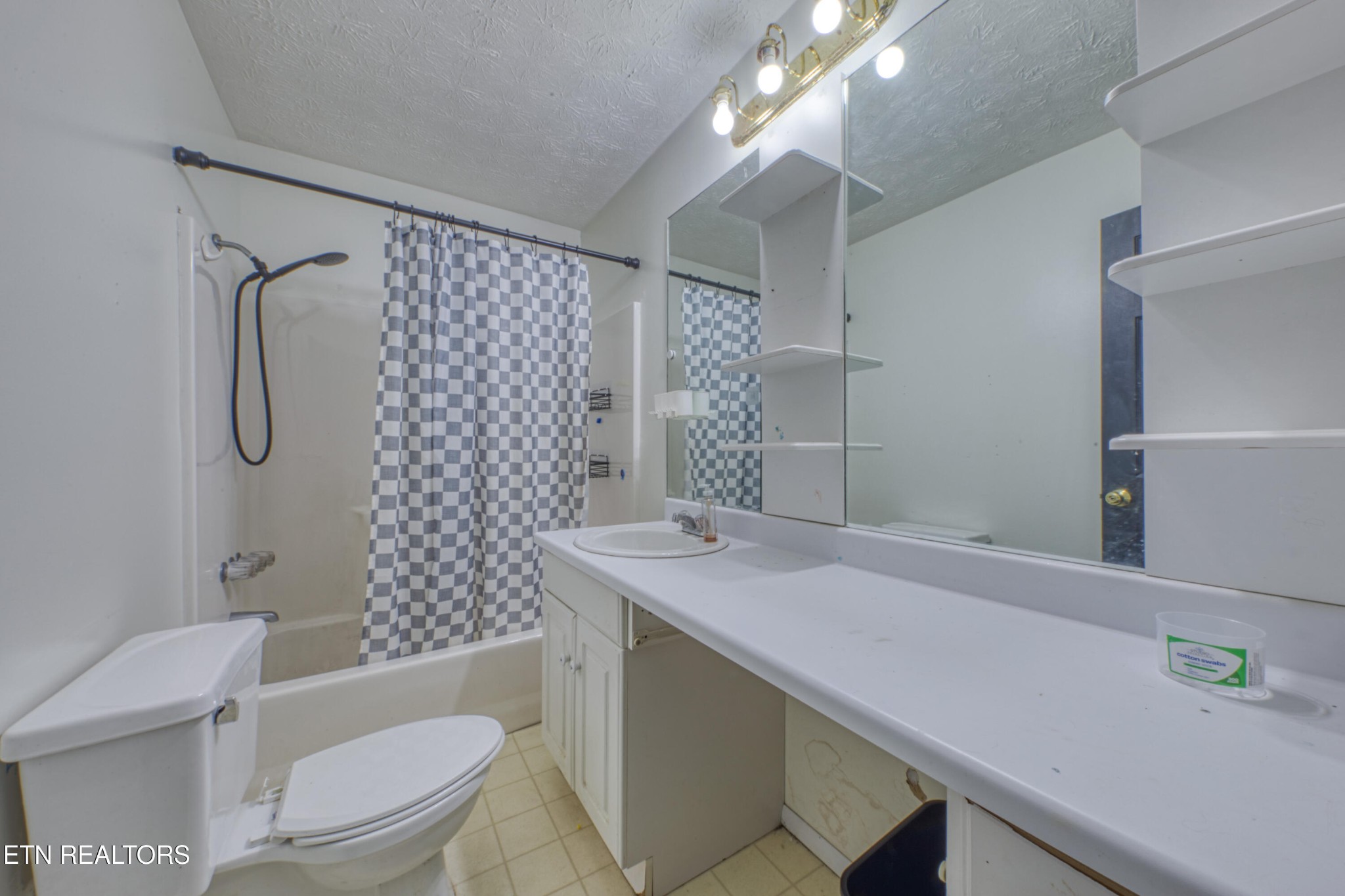 7700 McDaniel Road Knoxville, TN 37924 - Photo 14 of 18 a bathroom with a sink toilet vanity and shower