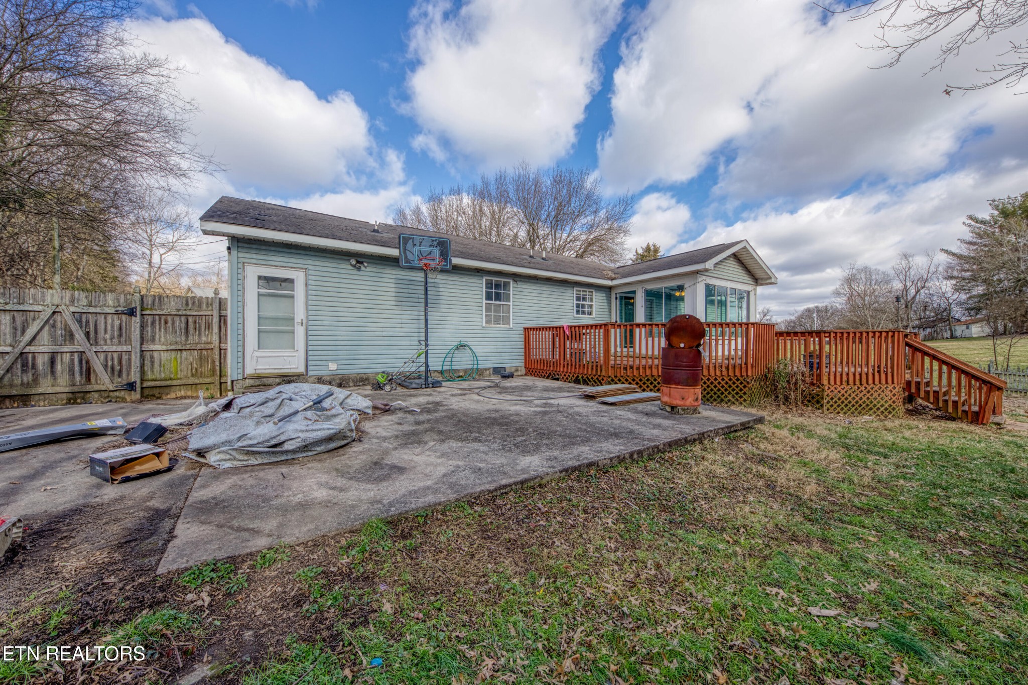 7700 McDaniel Road Knoxville, TN 37924 - Photo 4 of 18 a backyard of a house with barbeque oven table and chairs
