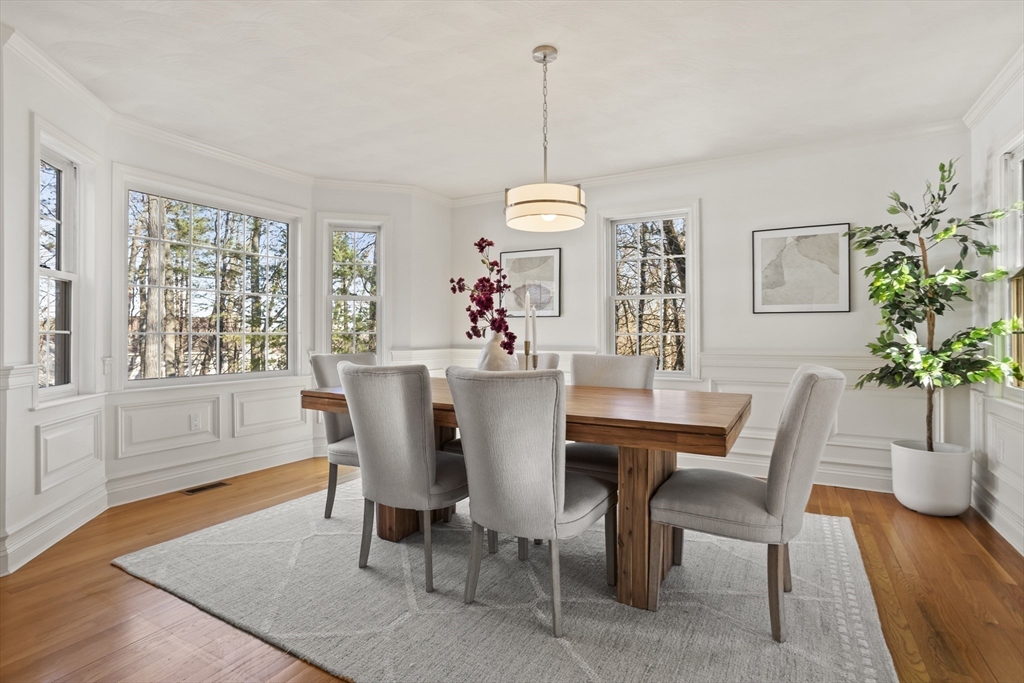 7 Eagles Nest Road Westford, MA 01886 - Photo 15 of 42 a dining room with furniture a chandelier and wooden floor