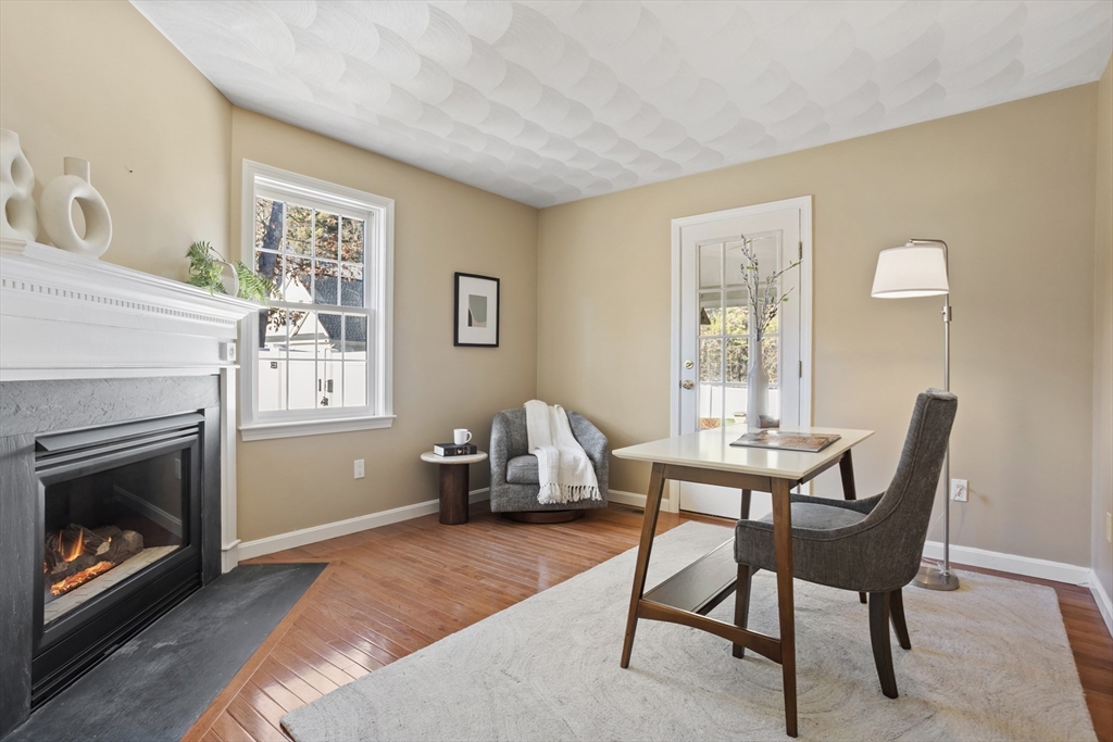 7 Eagles Nest Road Westford, MA 01886 - Photo 20 of 42 a living room with furniture a fireplace and a window