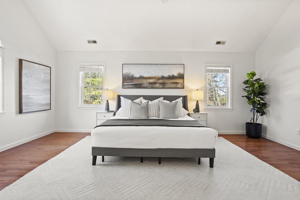 7 Eagles Nest Road Westford, MA 01886 - Photo 25 of 42 a spacious bedroom with a bed and a potted plant