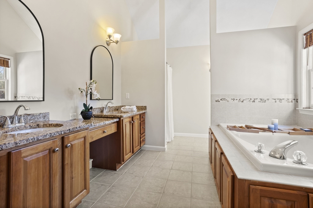 7 Eagles Nest Road Westford, MA 01886 - Photo 26 of 42 a bathroom with a sink and a mirror