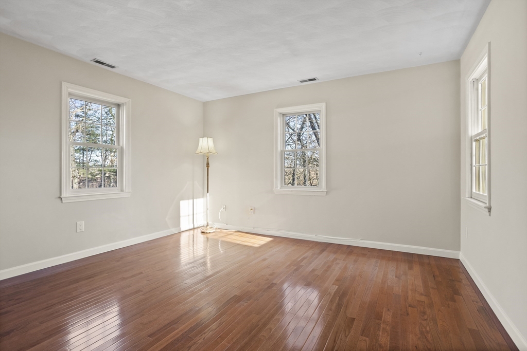 7 Eagles Nest Road Westford, MA 01886 - Photo 32 of 42 a view of empty room with wooden floor and fan