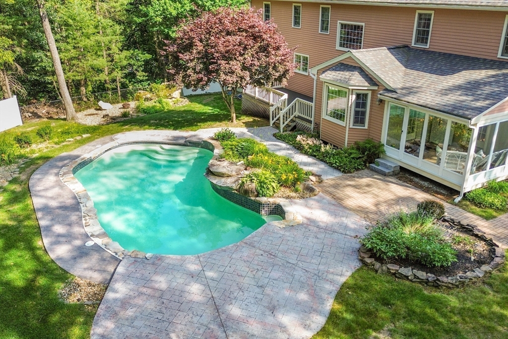 7 Eagles Nest Road Westford, MA 01886 - Photo 37 of 42 a aerial view of a house with a yard and potted plants