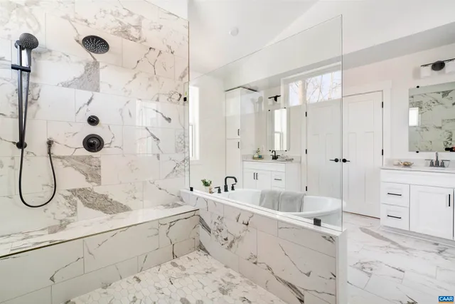 a bathroom with a double vanity sink mirror and shower