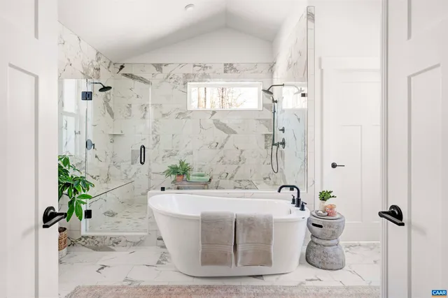 a white bath tub sitting in a bathroom