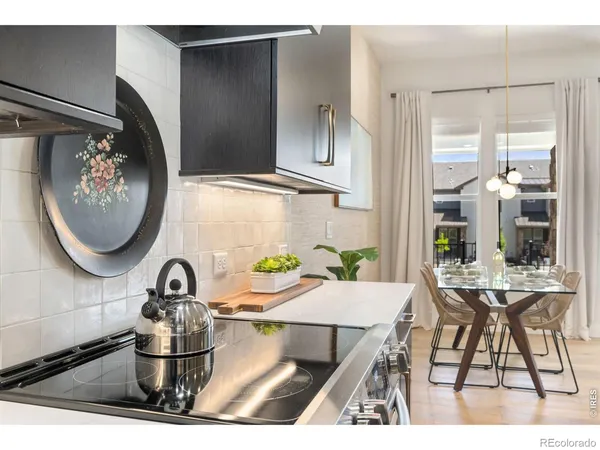 a kitchen with a table and a stove