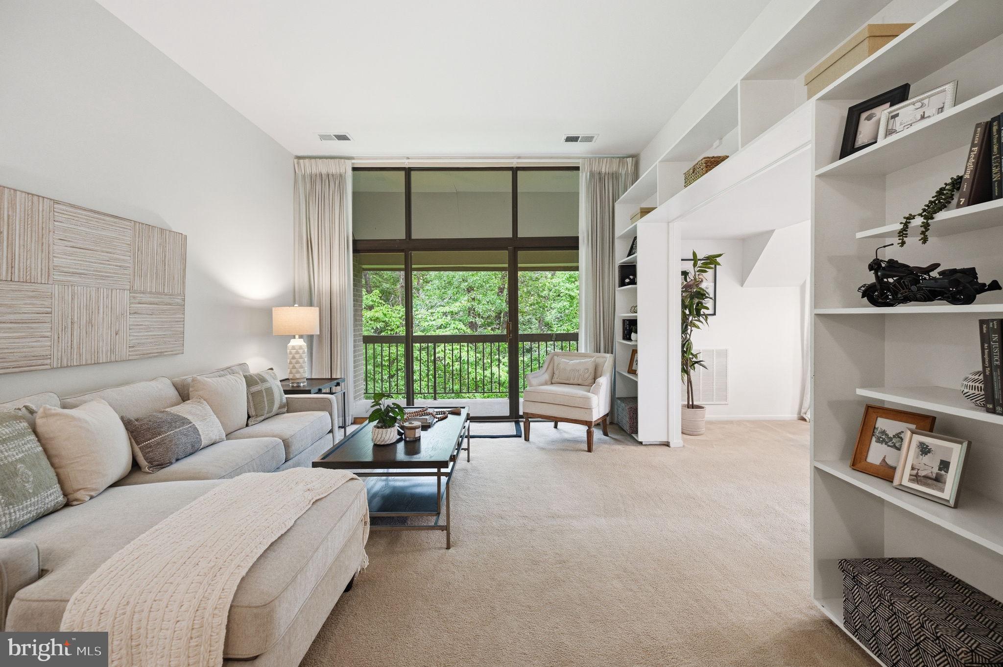 1659 Parkcrest Circle, Unit C Reston, VA 20190 - Photo 7 of 31 a living room with furniture and a large window