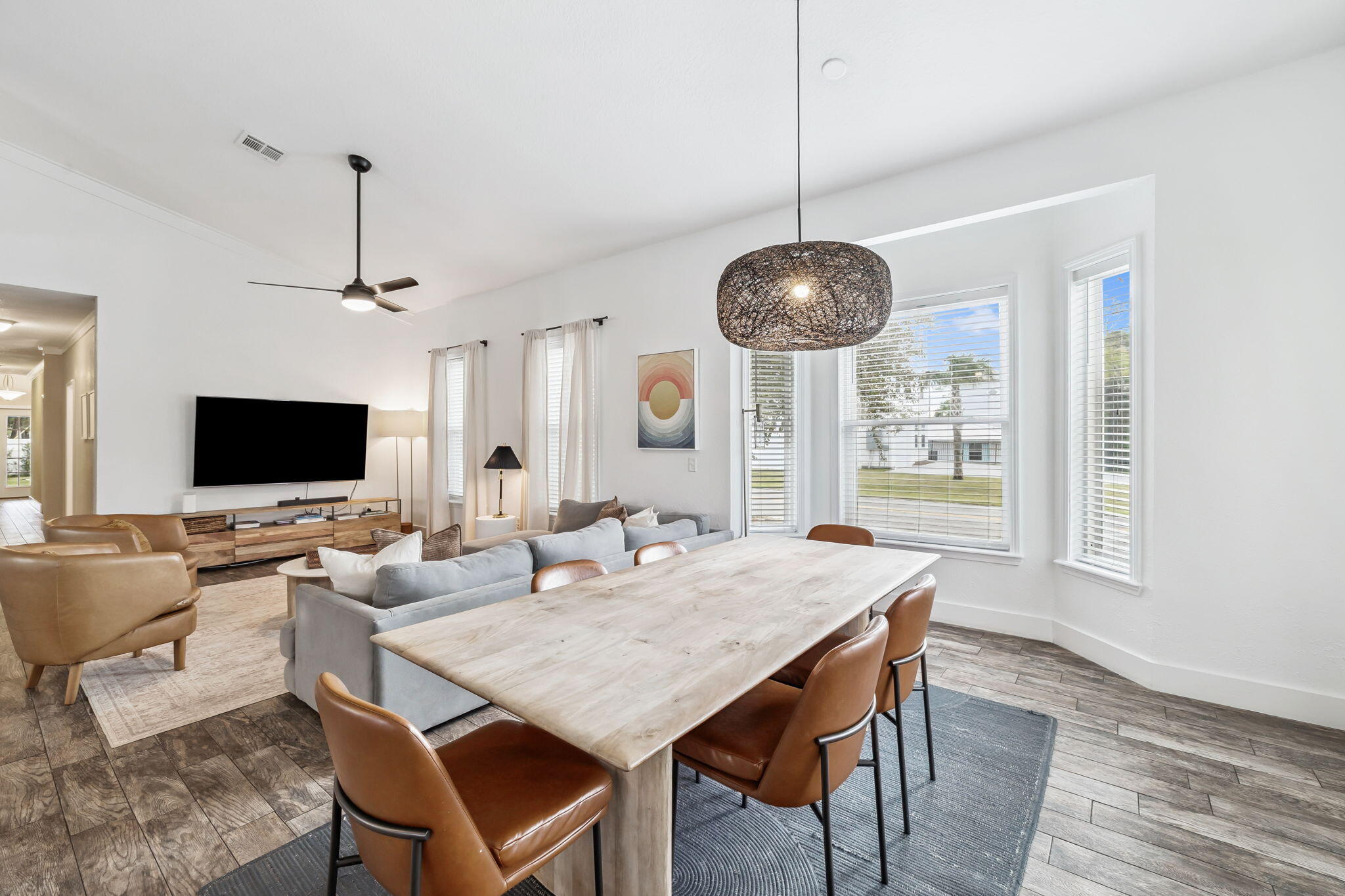 4585 Luke Avenue Destin, FL 32541 - Photo 11 of 50 a view of a dining room with furniture window and wooden floor