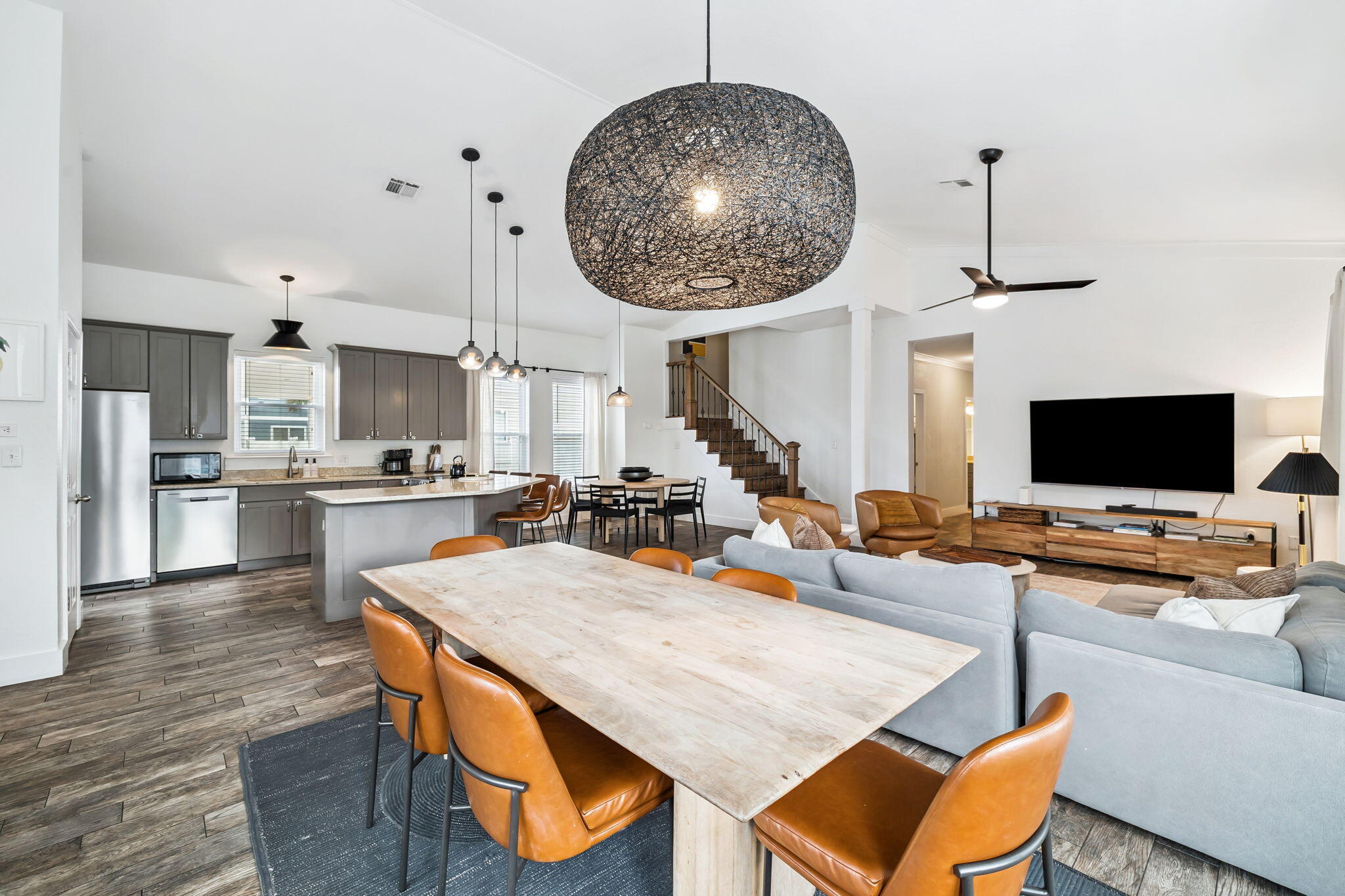 4585 Luke Avenue Destin, FL 32541 - Photo 12 of 50 an open kitchen with dining table and chairs