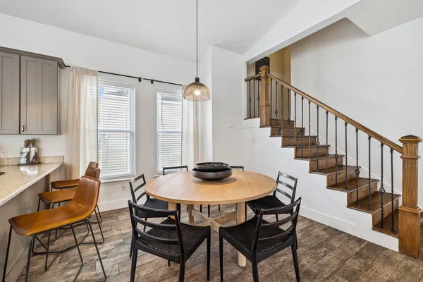 a view of a dining room with furniture and window