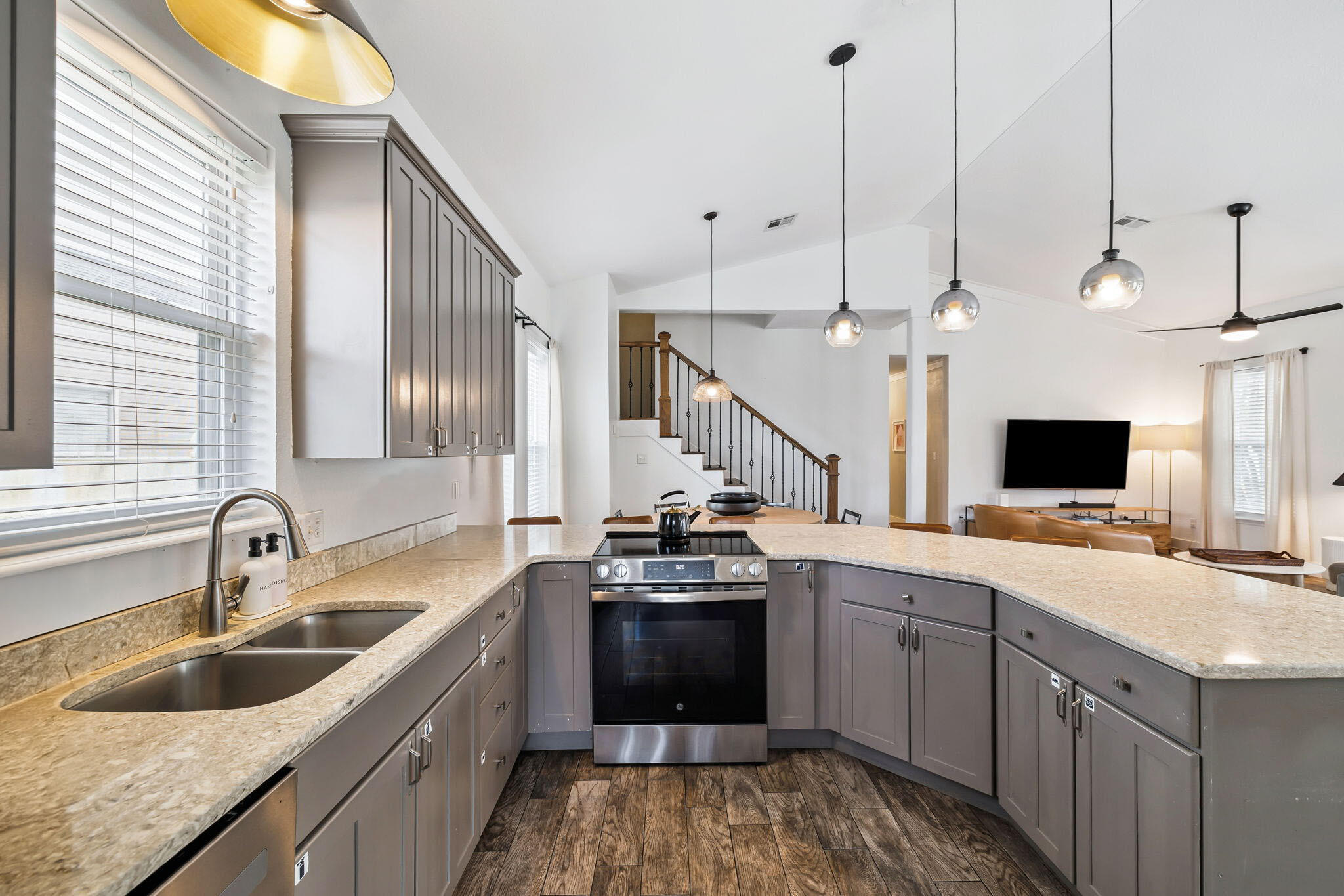 4585 Luke Avenue Destin, FL 32541 - Photo 15 of 50 a kitchen with a sink stove and microwave