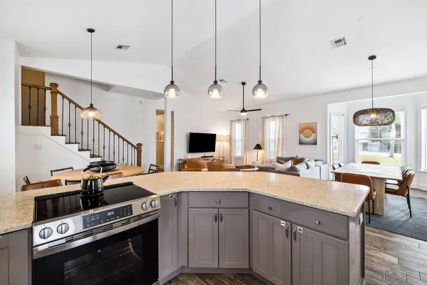 a kitchen with sink and stove