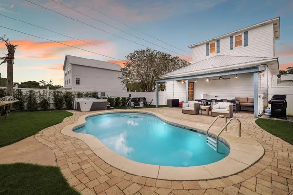 a view of a swimming pool with back yard