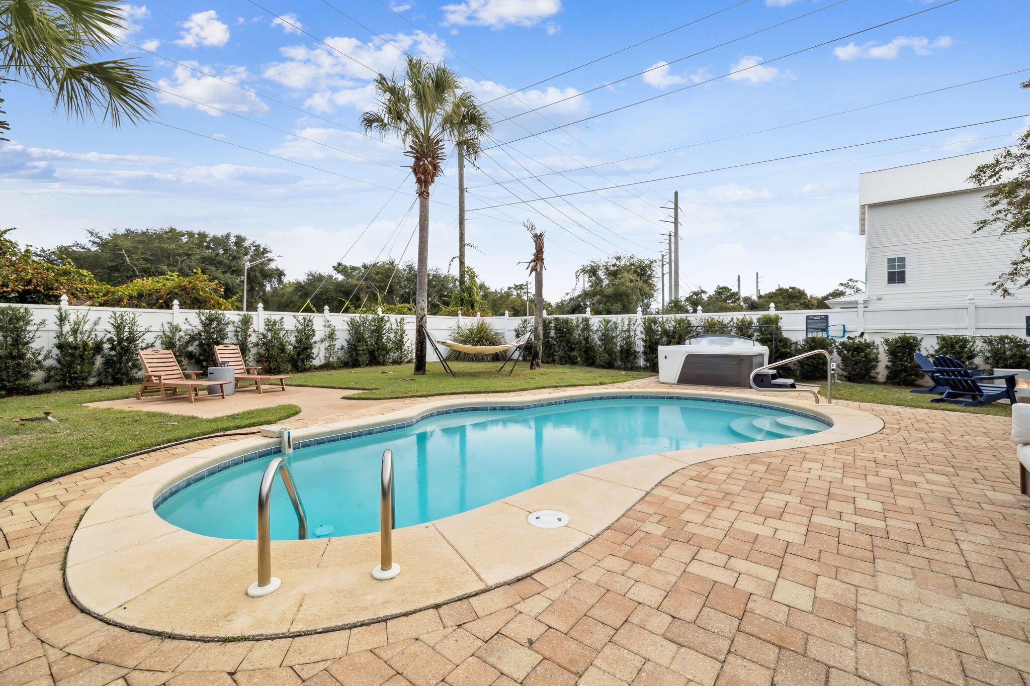 4585 Luke Avenue Destin, FL 32541 - Photo 21 of 50 a swimming pool with outdoor seating and yard