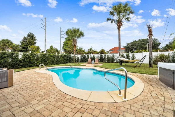a view of a swimming pool with a patio