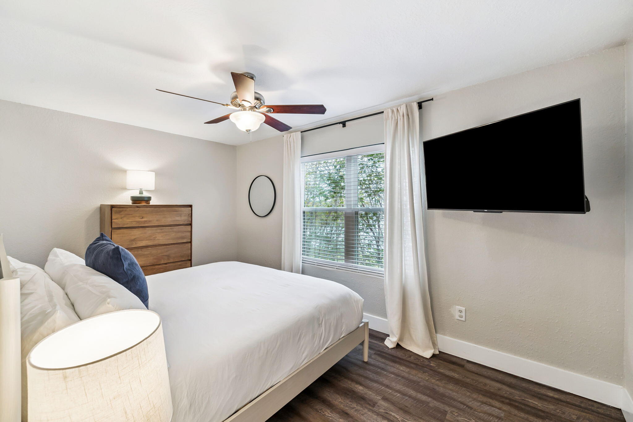 4585 Luke Avenue Destin, FL 32541 - Photo 42 of 50 a bedroom with a bed and a flat screen tv