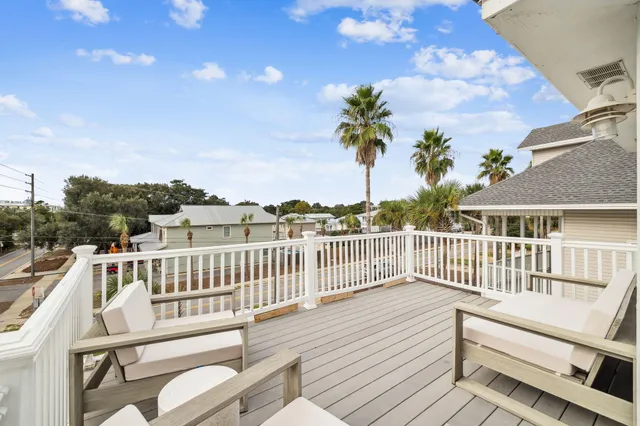 a view of a house with wooden deck