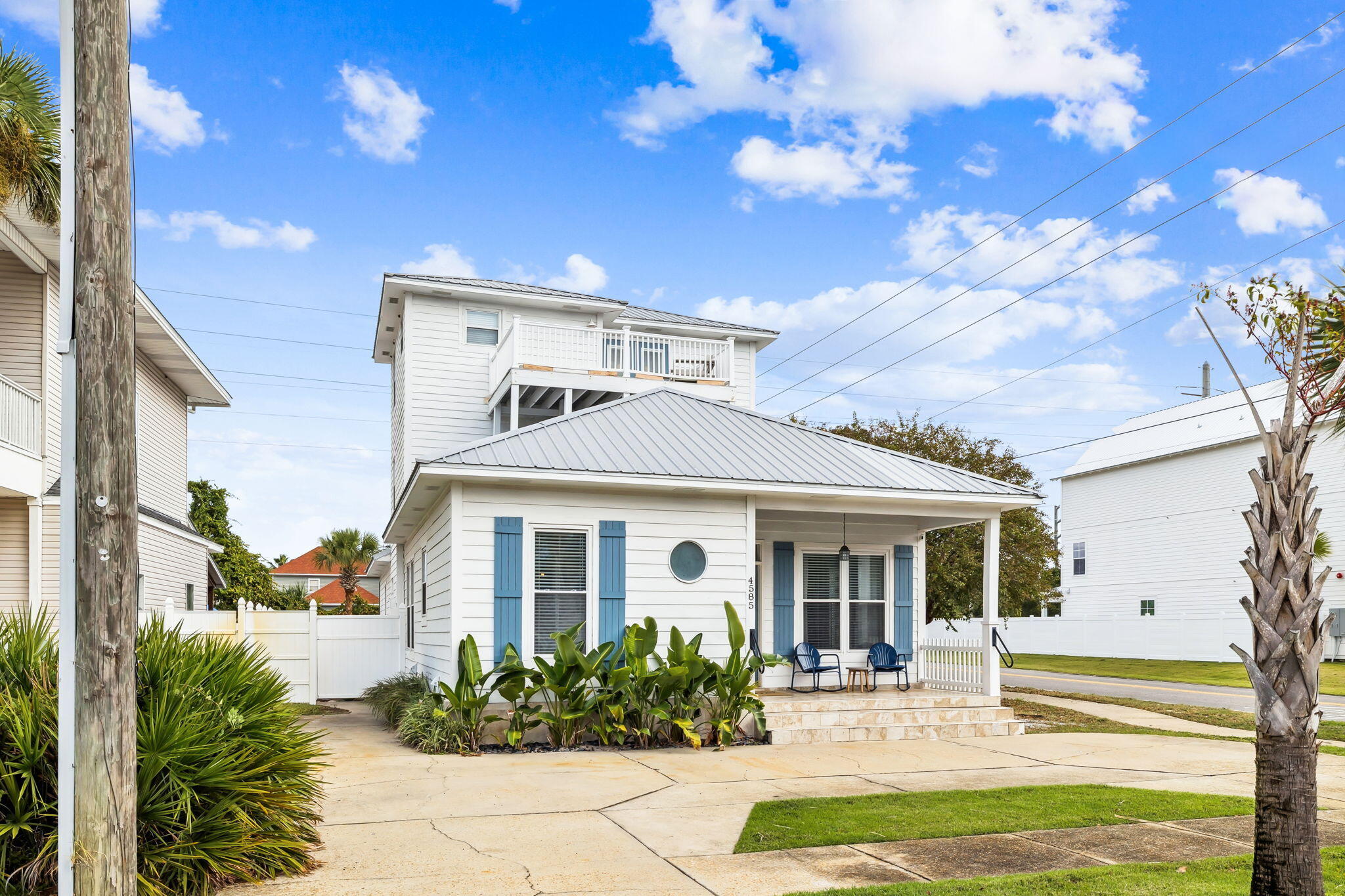 4585 Luke Avenue Destin, FL 32541 - Photo 48 of 50 a front view of a house with garden