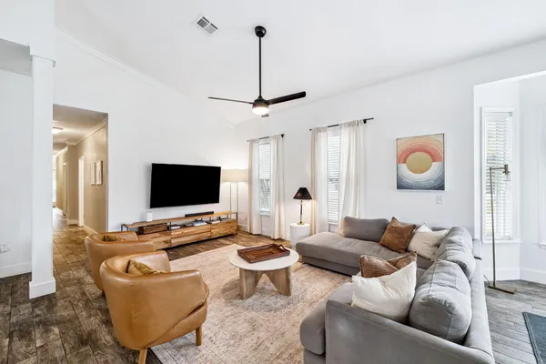 a living room with furniture and a flat screen tv