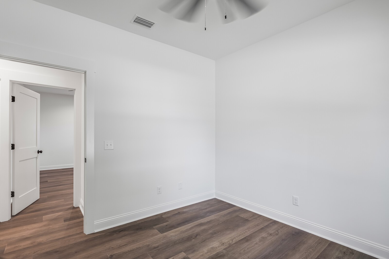 45055 Luther Street Callahan, FL 32011 - Photo 7 of 17 a view of an empty room with wooden floor and closet