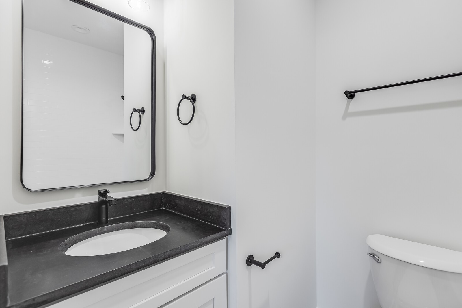 45055 Luther Street Callahan, FL 32011 - Photo 9 of 17 a bathroom with a granite countertop sink and a mirror