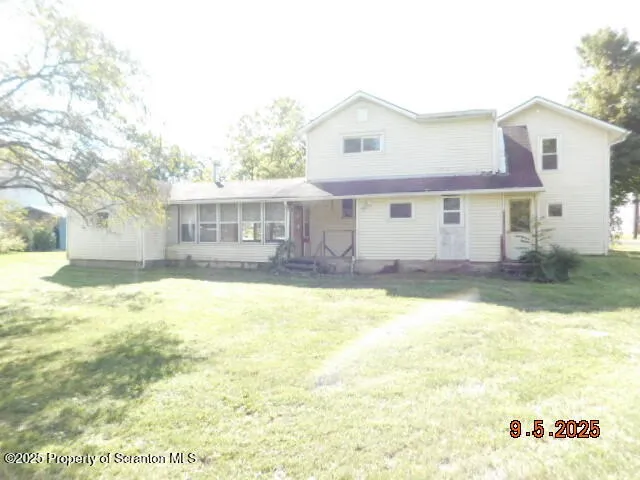 a view of a house with a swimming pool