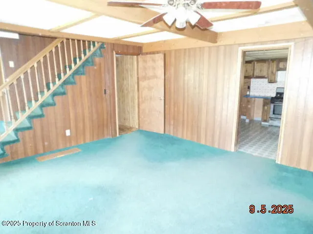 a view of livingroom with stairs