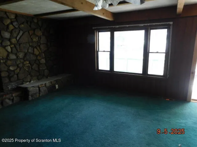 a view of an empty room and window