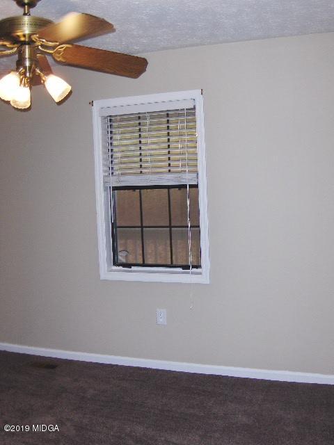 1057 Taylor Road Juliette, GA 31046 - Photo 14 of 30 an empty room with a window