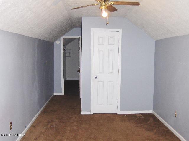 1057 Taylor Road Juliette, GA 31046 - Photo 22 of 30 an empty room with a empty space and a ceiling fan