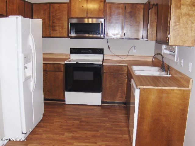 1057 Taylor Road Juliette, GA 31046 - Photo 8 of 30 a kitchen with a refrigerator sink and stove