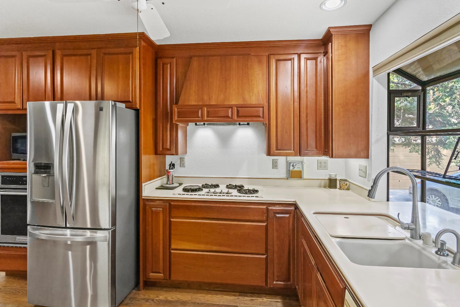 6543 Crosswoods Circle Citrus Heights, CA 95621 - Photo 12 of 33 a kitchen with a refrigerator stove and sink