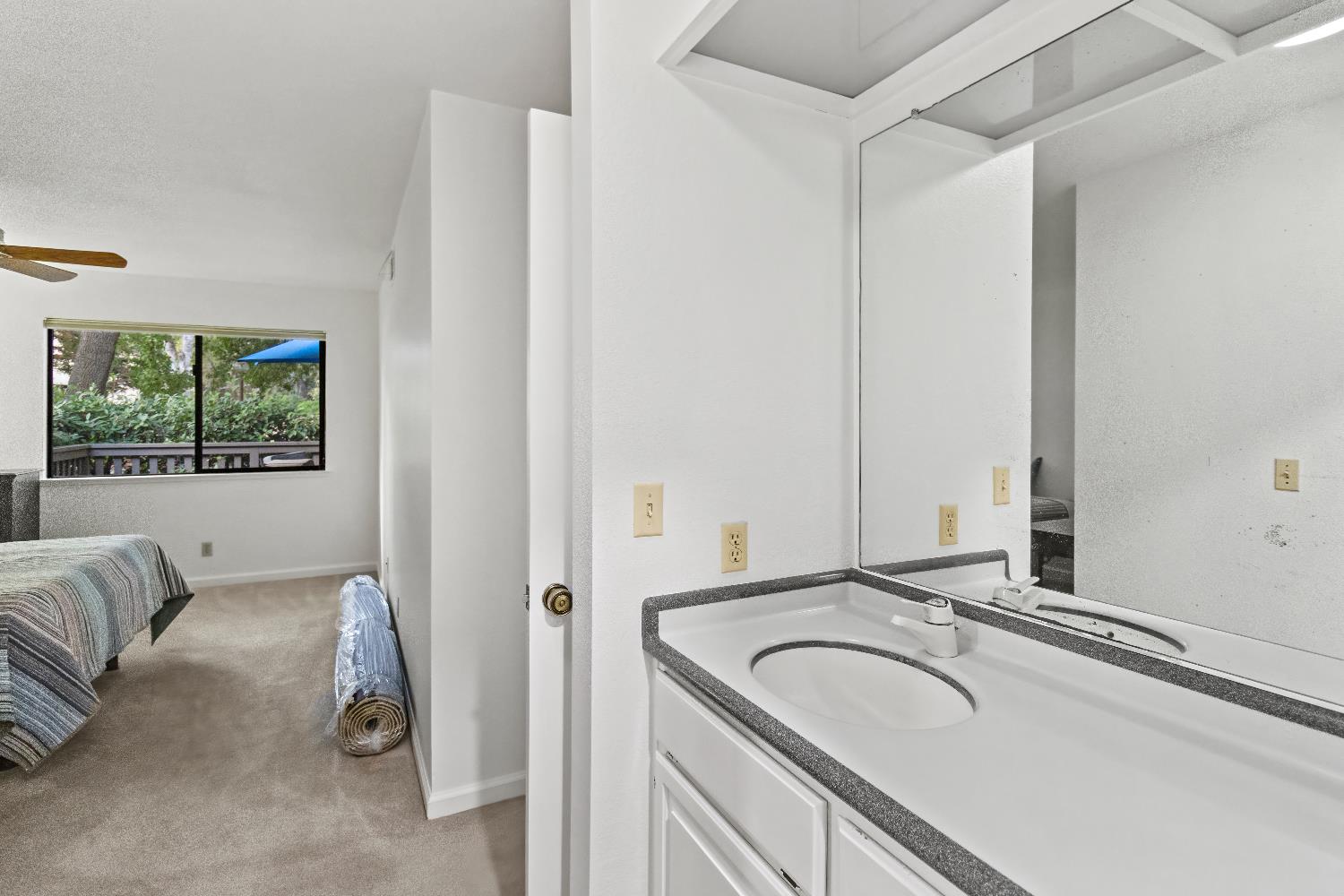 6543 Crosswoods Circle Citrus Heights, CA 95621 - Photo 22 of 33 a bathroom with a granite countertop sink and a bathtub