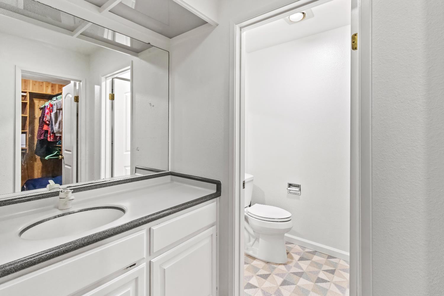 6543 Crosswoods Circle Citrus Heights, CA 95621 - Photo 24 of 33 a bathroom with a sink a toilet and a mirror