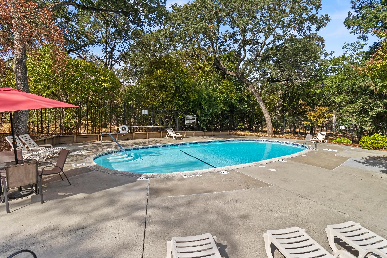6543 Crosswoods Circle Citrus Heights, CA 95621 - Photo 32 of 33 a view of a swimming pool with sitting area